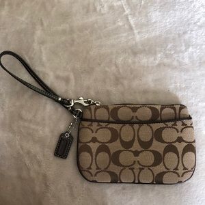 Coach wristlet with outside pocket